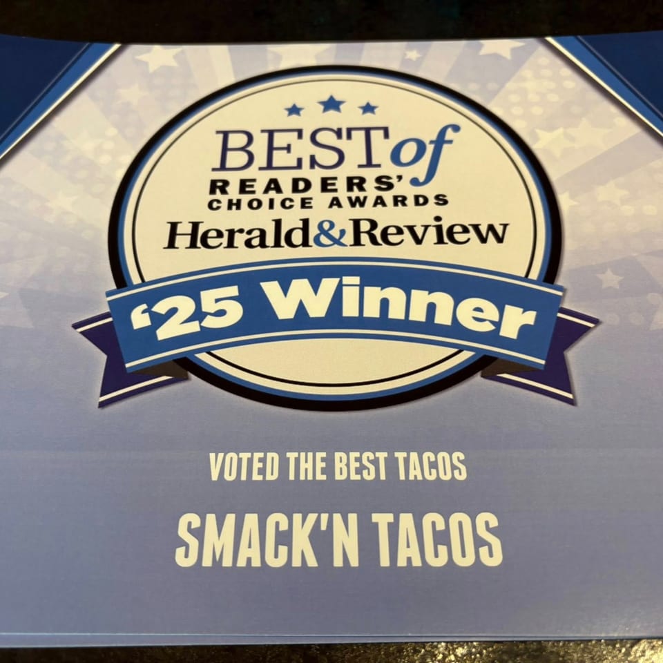 Smack'n Tacos' "Best of Readers' Choice Awards Herald & Review '25 Winner" certificate for best tacos.