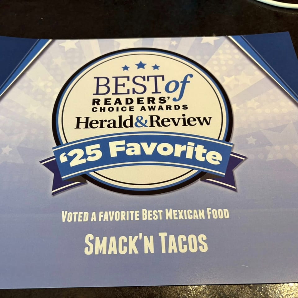 A blue and white award certificate for Smack'n Tacos, voted '25 Favorite Best Mexican Food'.
